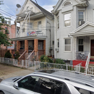 outside of a two-story house in Cypress Hills in Brooklyn